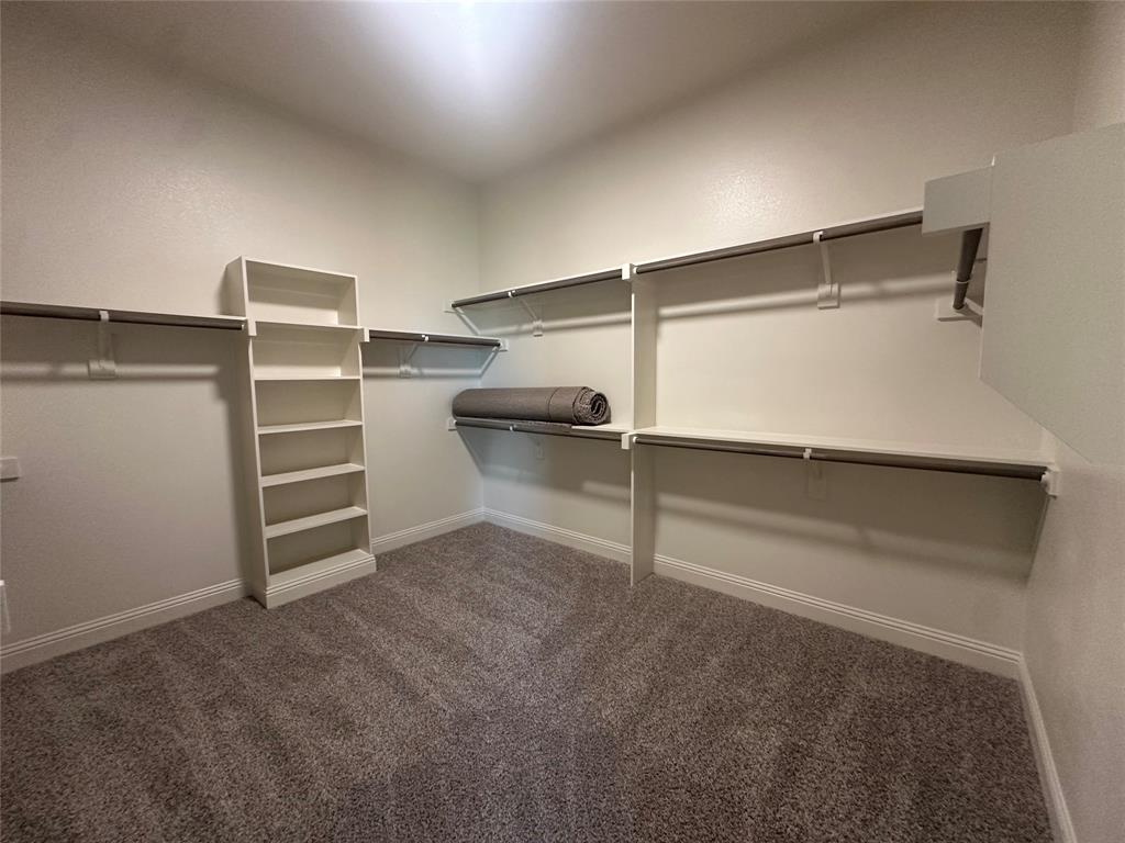 9424 Bluestem Lane DISH, TX 76247 - Photo 21 of 28 a view of an empty walk in closet