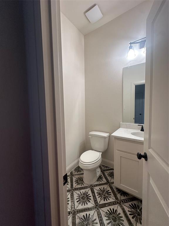 9424 Bluestem Lane DISH, TX 76247 - Photo 25 of 28 a bathroom with a sink toilet and a mirror