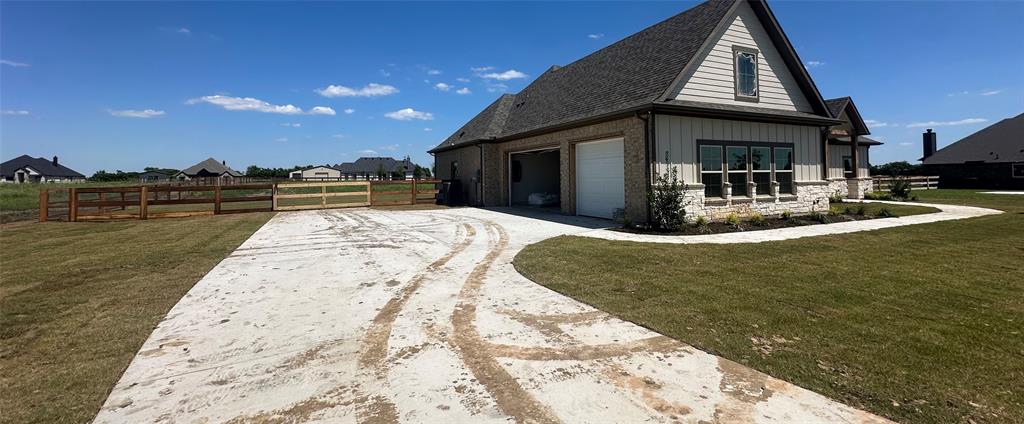 9424 Bluestem Lane DISH, TX 76247 - Photo 3 of 28 a view of a house with roof deck