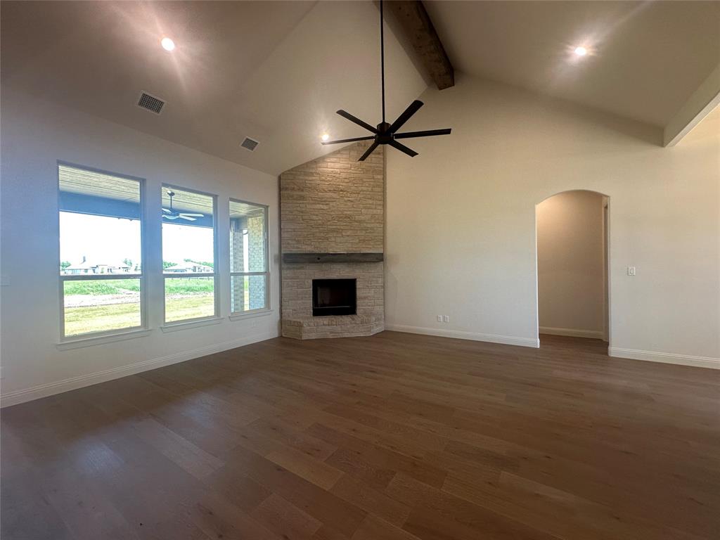 9424 Bluestem Lane DISH, TX 76247 - Photo 8 of 28 a view of an empty room with a window and a fireplace