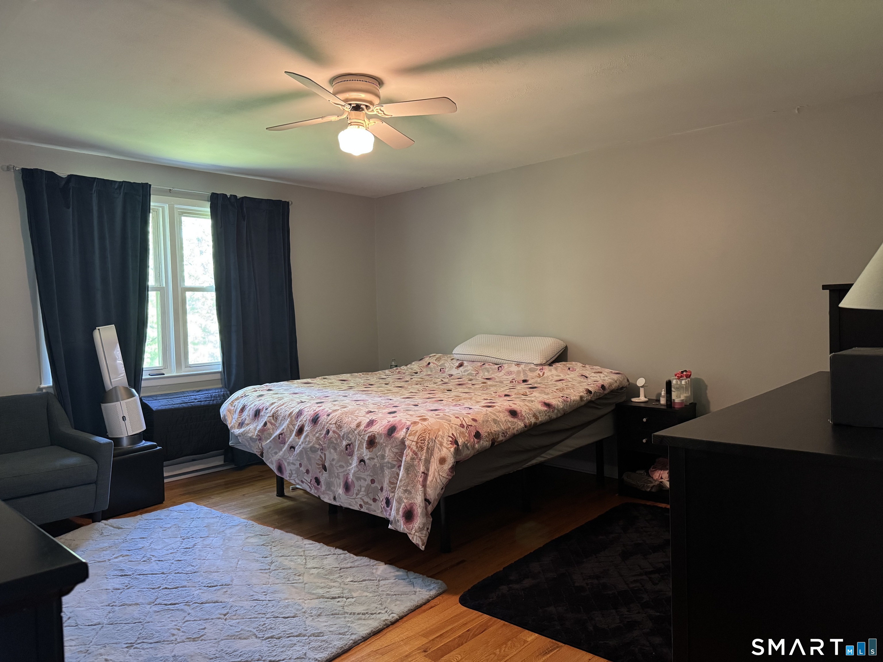 480 Radmere Road, Unit B Cheshire, CT 06410 - Photo 9 of 13 a bed sitting in a bedroom next to a window