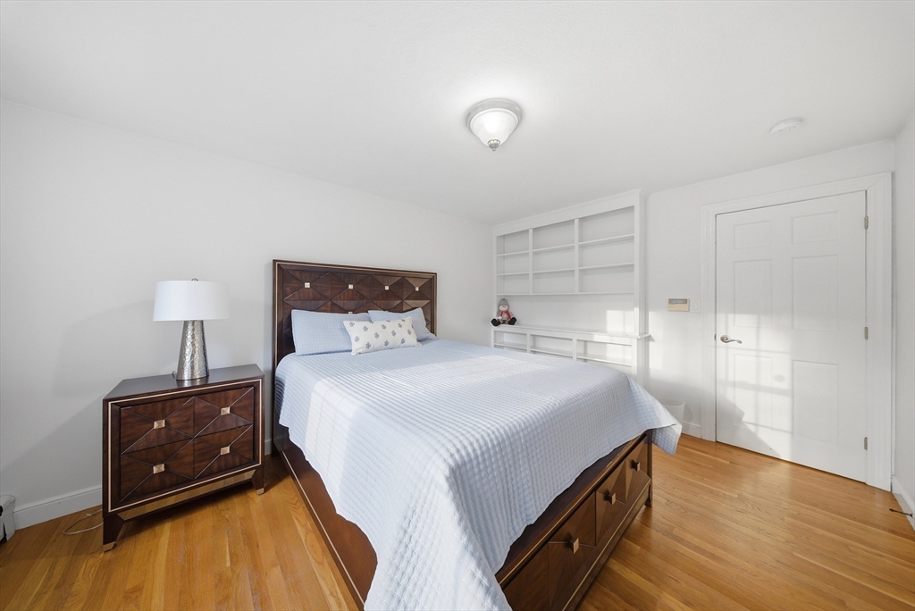 329 Orchard Street Millis, MA 02054 - Photo 20 of 42 a bedroom with a bed and a lamp