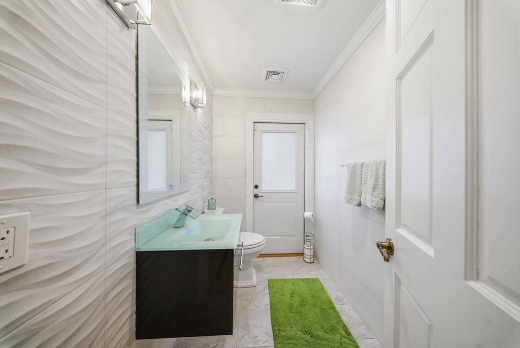329 Orchard Street Millis, MA 02054 - Photo 21 of 42 a bathroom with a sink and a mirror