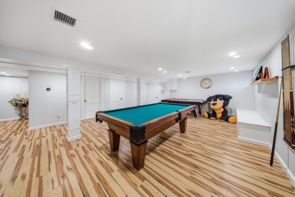 329 Orchard Street Millis, MA 02054 - Photo 25 of 42 a room with wooden floor and pool table