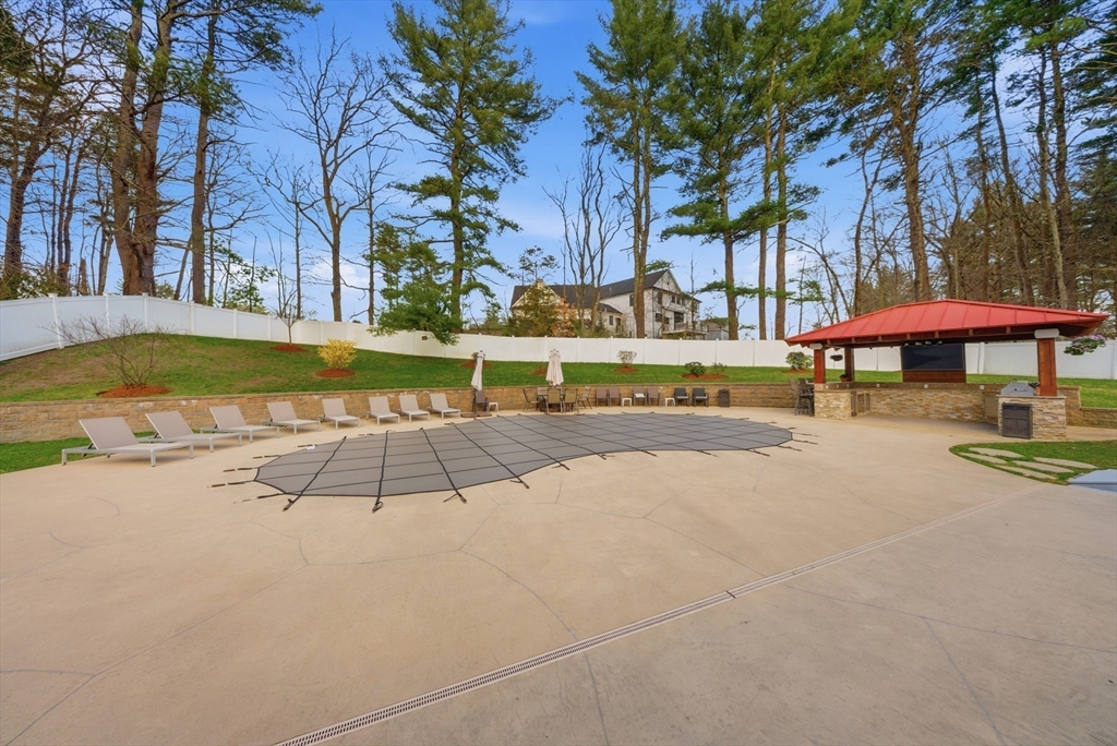329 Orchard Street Millis, MA 02054 - Photo 34 of 42 a view of a swimming pool with sitting area and furniture