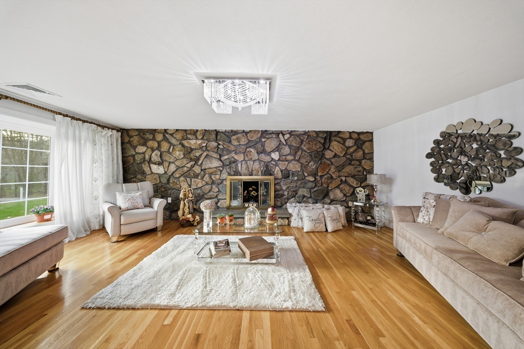 329 Orchard Street Millis, MA 02054 - Photo 9 of 42 a living room with furniture and a couch