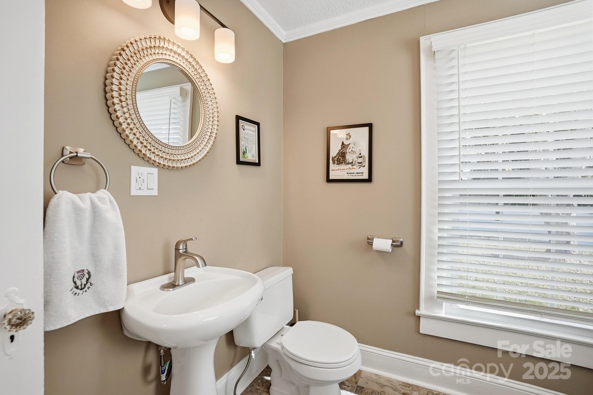 708 Mable Avenue Kannapolis, NC 28083 - Photo 14 of 48 a bathroom with a toilet a sink and a mirror