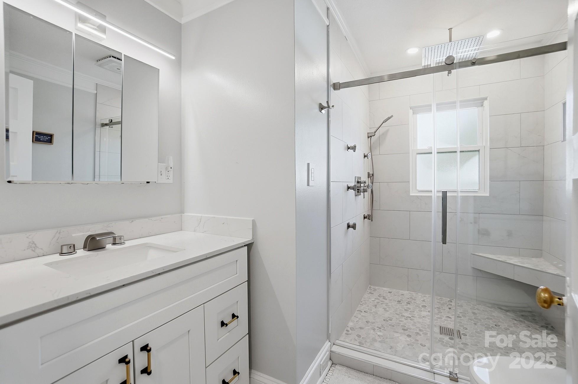 708 Mable Avenue Kannapolis, NC 28083 - Photo 20 of 48 a bathroom with a shower sink and mirror
