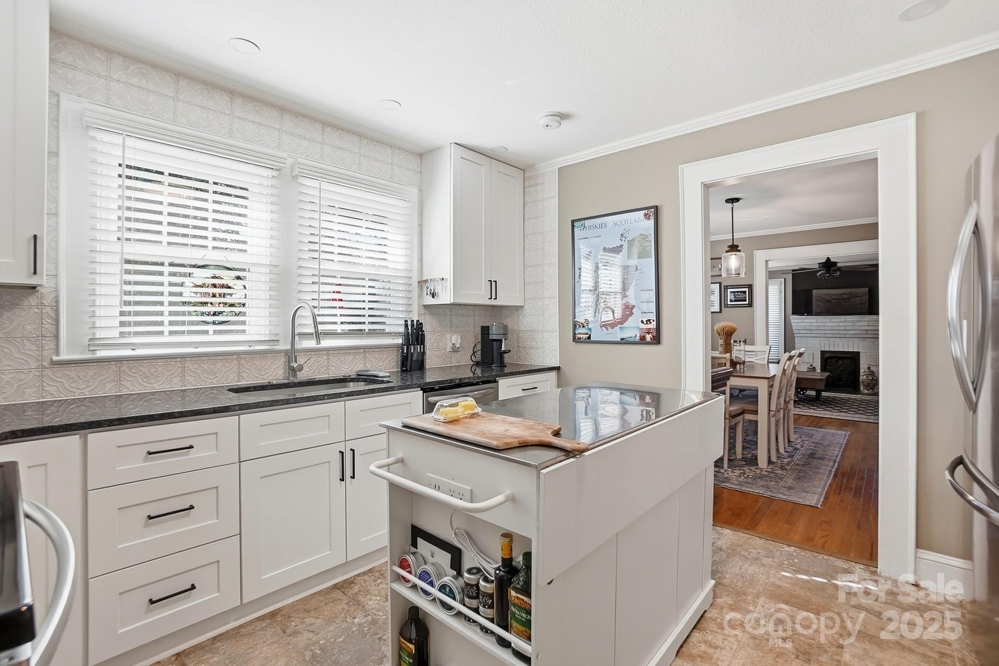 708 Mable Avenue Kannapolis, NC 28083 - Photo 9 of 48 a living room with stainless steel appliances granite countertop furniture and a window