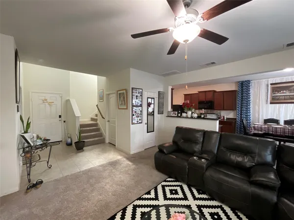 a bedroom with furniture and a flat screen tv
