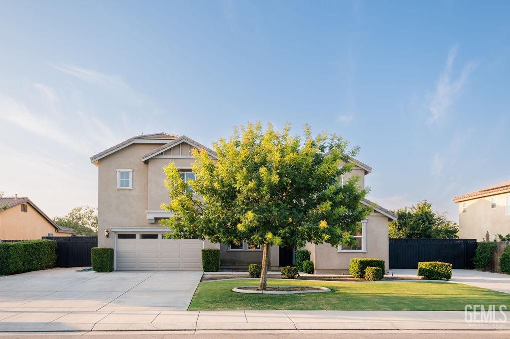 Undisclosed Address Bakersfield, CA 93314 - Photo 1 of 54 a front view of a house with a yard