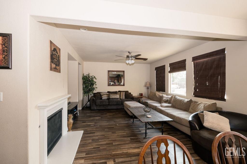 Undisclosed Address Bakersfield, CA 93314 - Photo 15 of 54 a living room with furniture and a fireplace