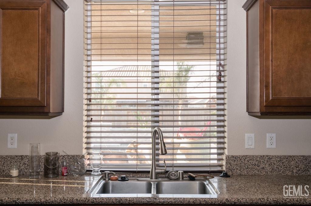 Undisclosed Address Bakersfield, CA 93314 - Photo 17 of 54 a kitchen with a window and a sink
