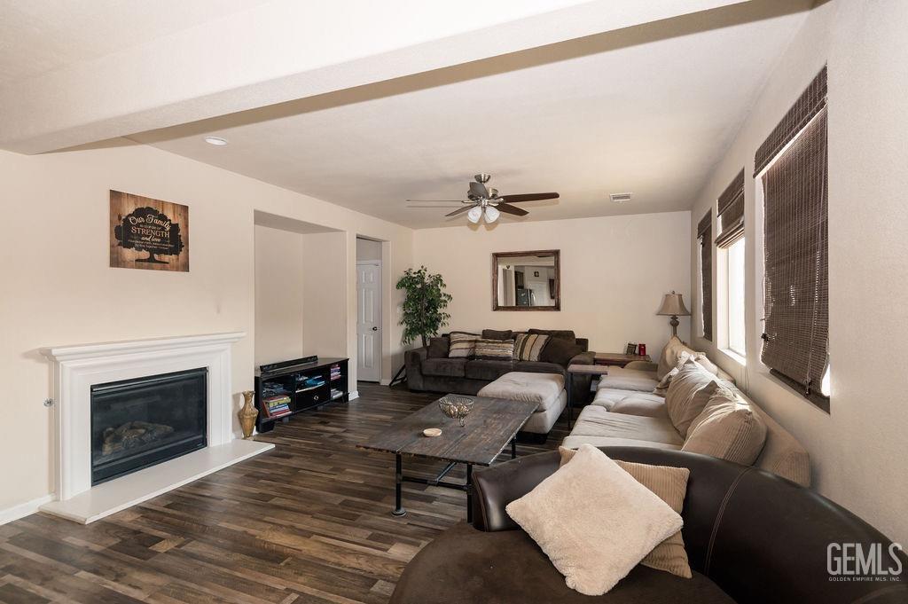 Undisclosed Address Bakersfield, CA 93314 - Photo 18 of 54 a living room with furniture and a fireplace
