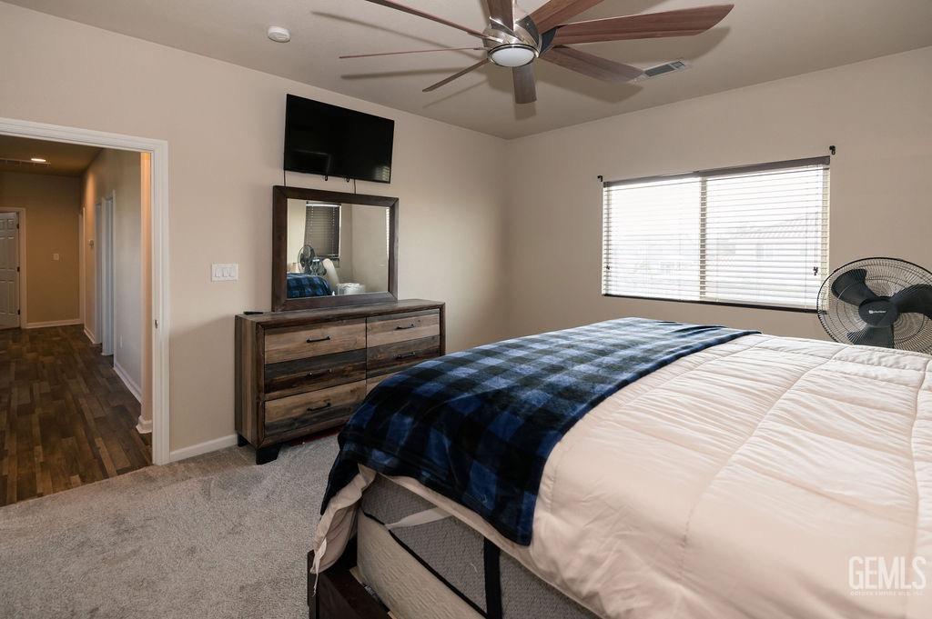 Undisclosed Address Bakersfield, CA 93314 - Photo 28 of 54 a bedroom with a bed and flat screen tv