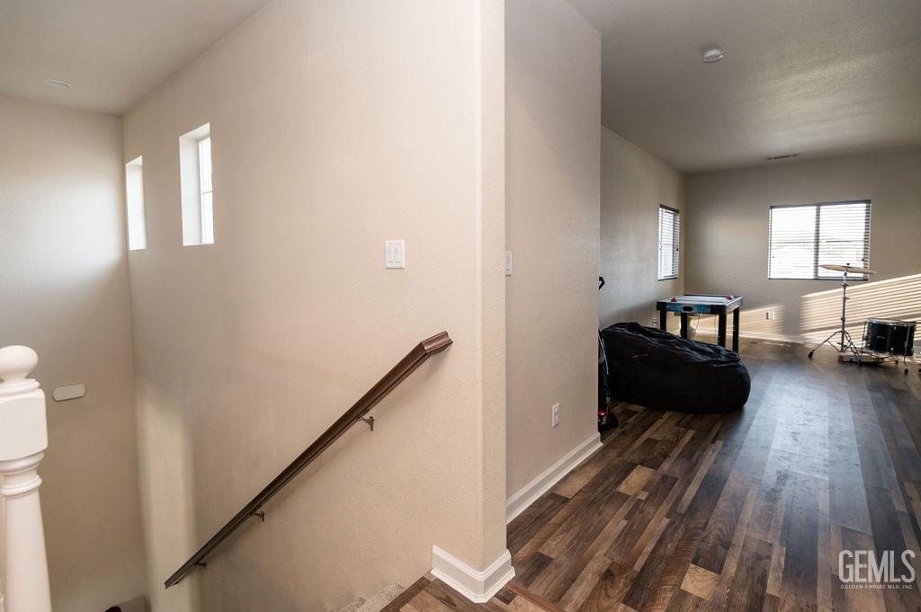 Undisclosed Address Bakersfield, CA 93314 - Photo 36 of 54 a living room with furniture and a wooden floor