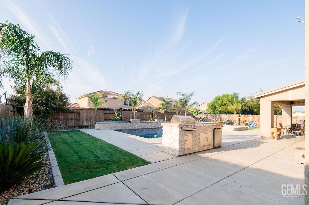 Undisclosed Address Bakersfield, CA 93314 - Photo 45 of 54 a view of a backyard and a garden