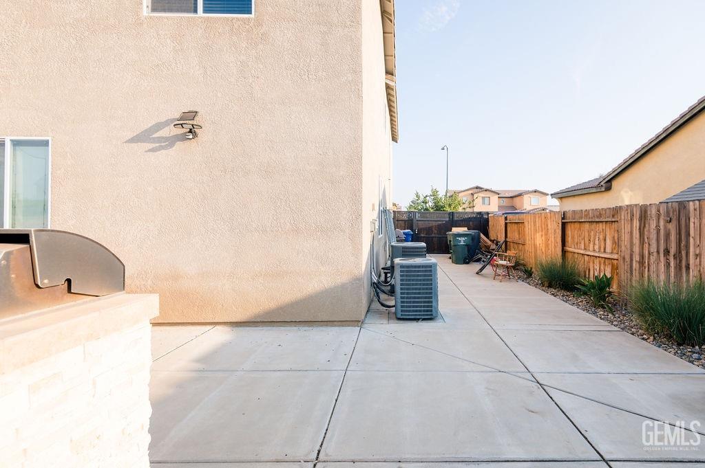 Undisclosed Address Bakersfield, CA 93314 - Photo 53 of 54 a hallway with a couch and potted plants