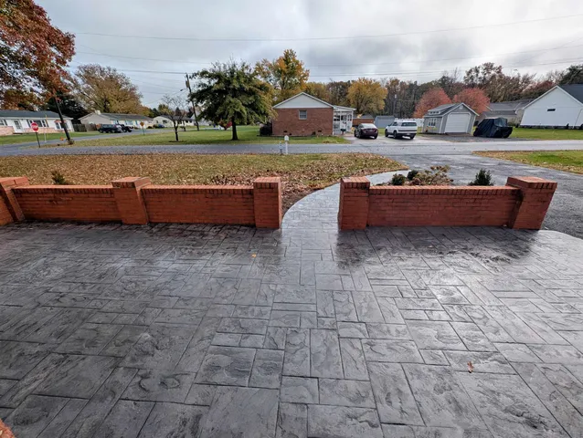 a view of swimming pool with outdoor seating and a garden