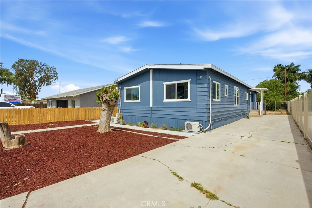 33098 Finch Street Winchester, CA 92596 - Photo 1 of 36 a front view of a house with a yard