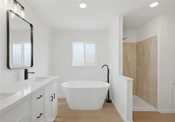 a bathroom with a bathtub and a sink