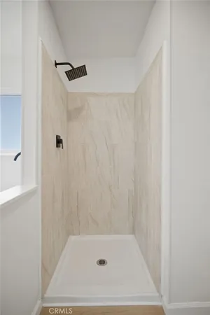 a bathroom with a shower and a bath tub