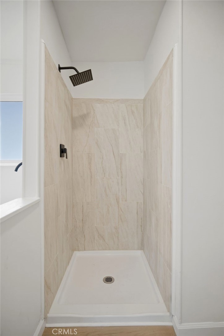 33098 Finch Street Winchester, CA 92596 - Photo 16 of 36 a bathroom with a shower and a bath tub