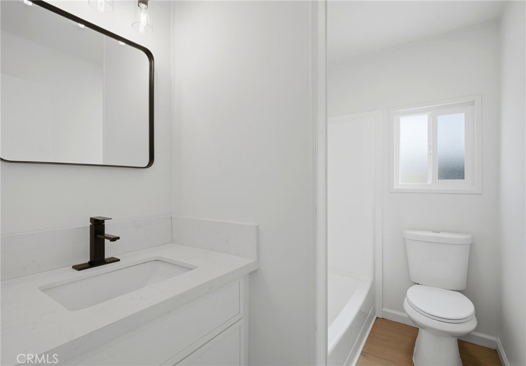 33098 Finch Street Winchester, CA 92596 - Photo 22 of 36 a bathroom with a toilet sink and mirror