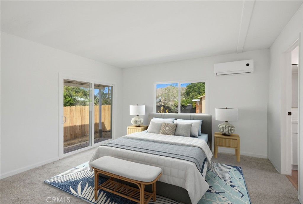 33098 Finch Street Winchester, CA 92596 - Photo 26 of 36 a bedroom with a bed and glass window