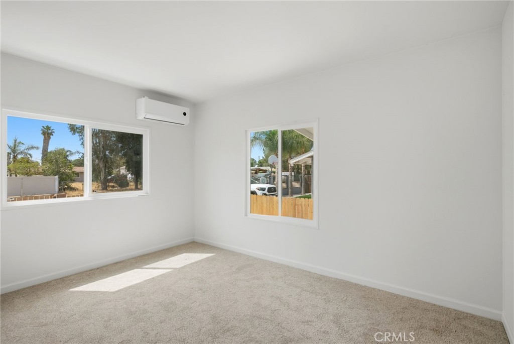 33098 Finch Street Winchester, CA 92596 - Photo 30 of 36 an empty room with windows