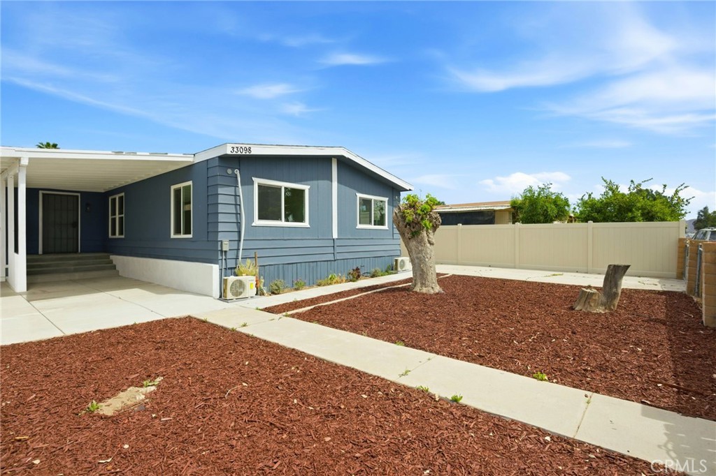 33098 Finch Street Winchester, CA 92596 - Photo 3 of 36 a house view with a backyard space