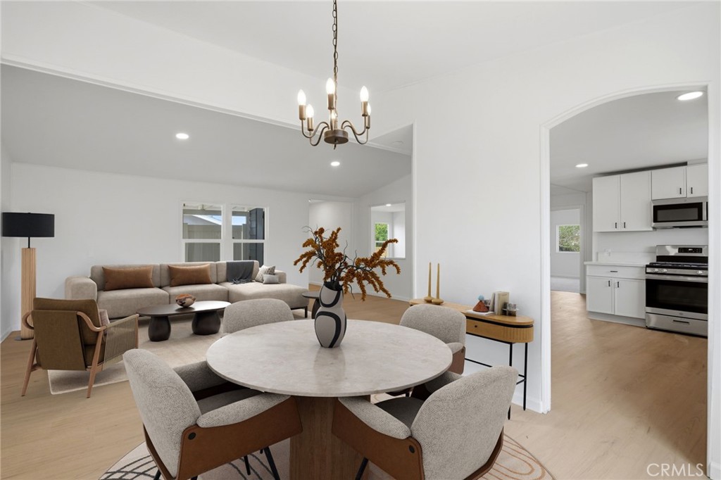 33098 Finch Street Winchester, CA 92596 - Photo 6 of 36 a view of a dining room with furniture and wooden floor