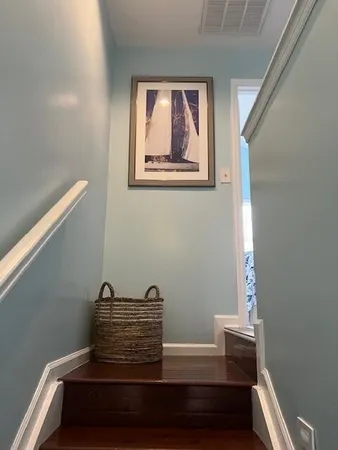 a bedroom with a bed chair and a window