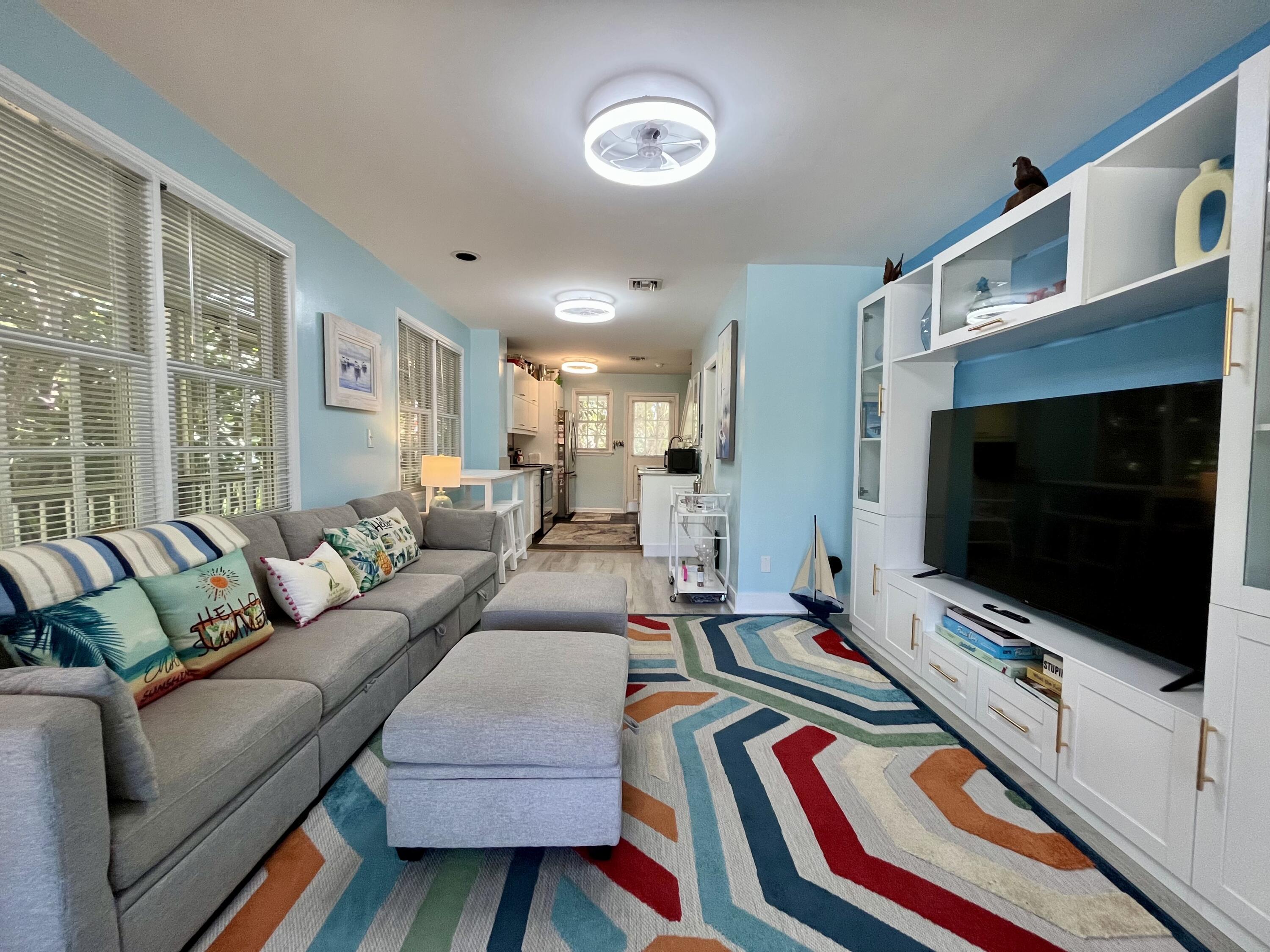 68 Merganser Lane Key West, FL 33040 - Photo 2 of 21 a living room with furniture and a flat screen tv