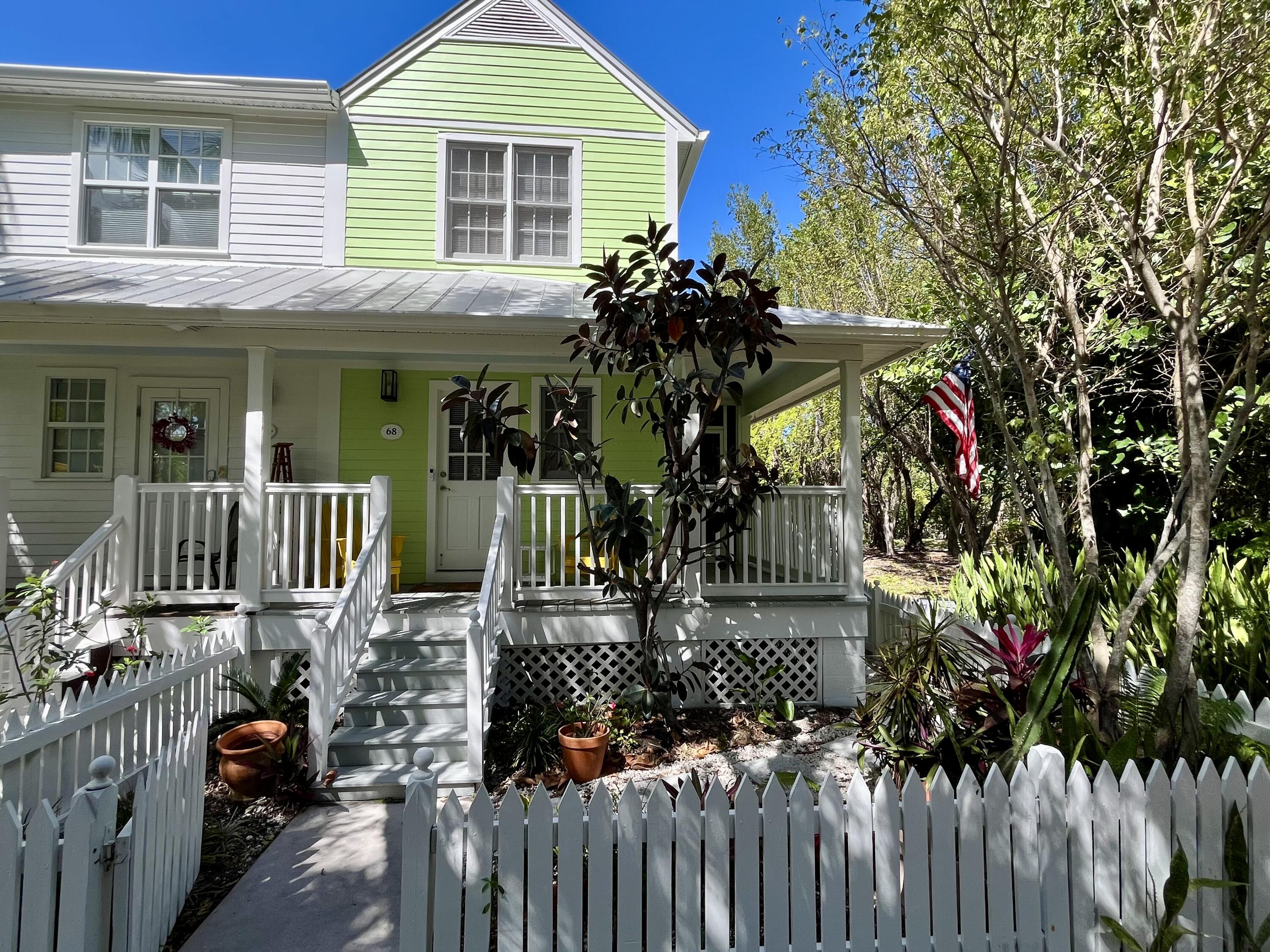 68 Merganser Lane Key West, FL 33040 - Photo 6 of 21 a view of a house with wooden fence