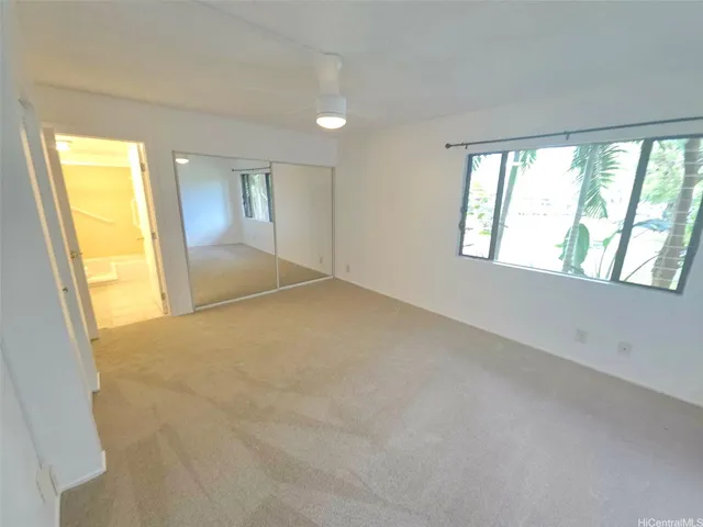 a bathroom with a double vanity sink mirror and toilet