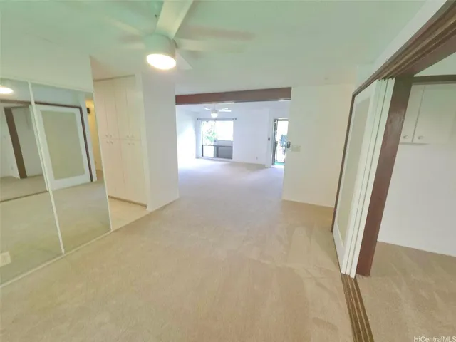 a view of an empty room with a balcony