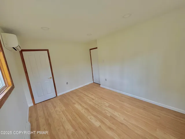 a bathroom with a toilet sink and a mirror
