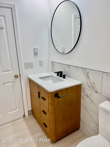 a view of a house with a wooden deck