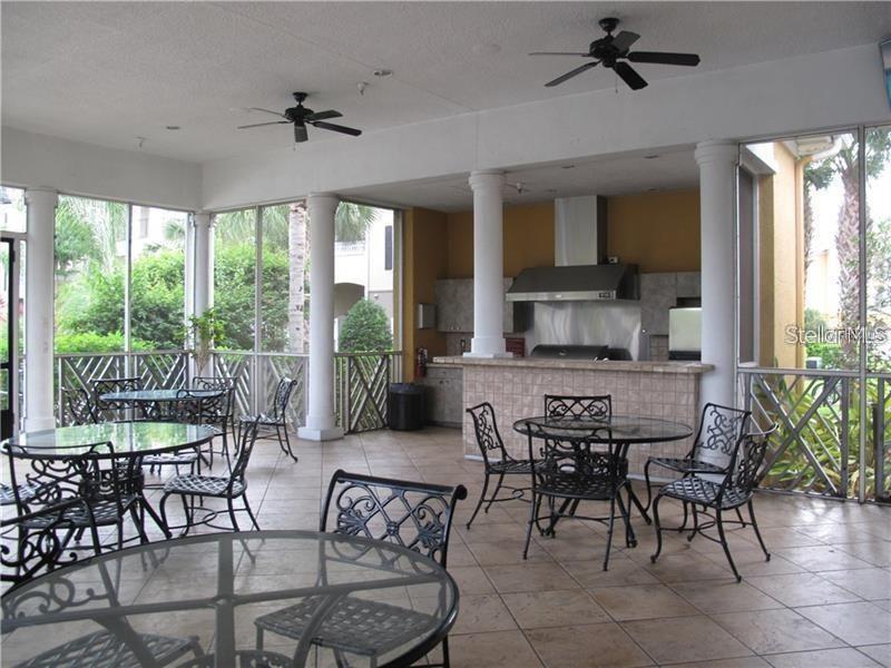 3593 Conroy Road, Unit 421 Orlando, FL 32839 - Photo 24 of 28 a view of a dining room with furniture window and outside view