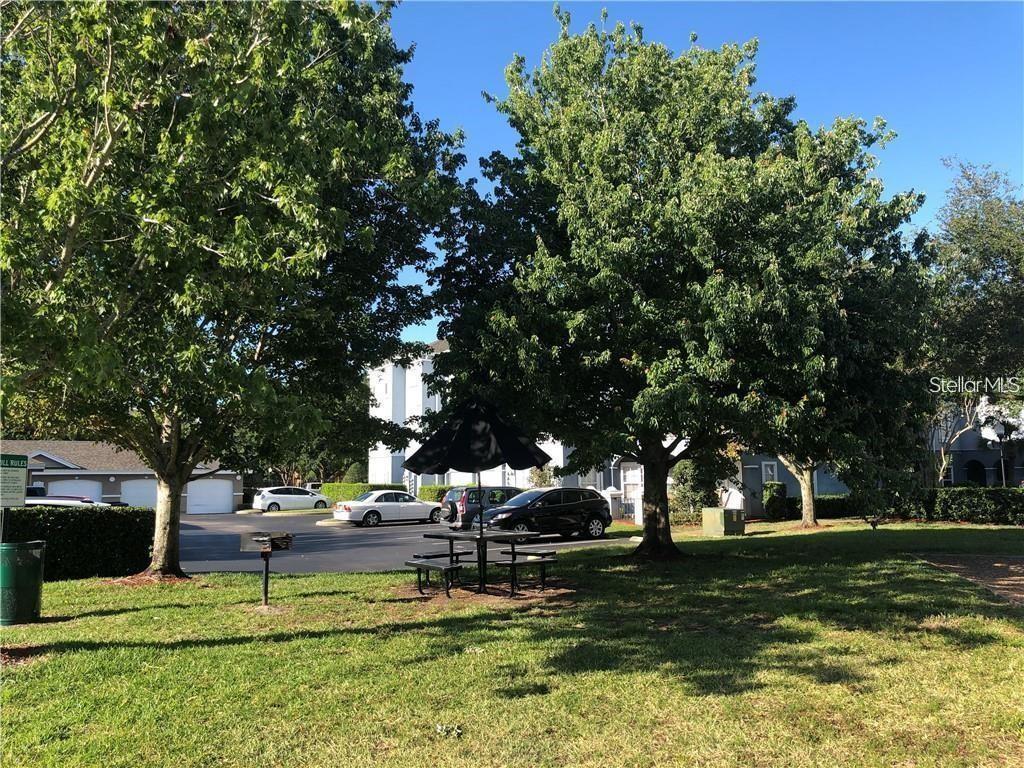 3593 Conroy Road, Unit 421 Orlando, FL 32839 - Photo 25 of 28 a view of a park with large trees