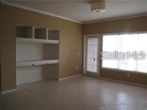 3593 Conroy Road, Unit 421 Orlando, FL 32839 - Photo 3 of 28 a view of an empty room with a window