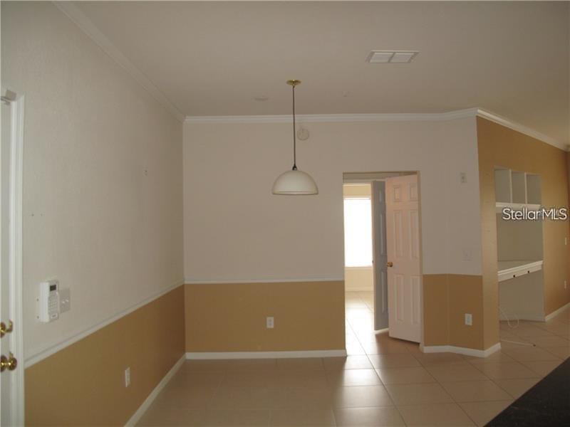 3593 Conroy Road, Unit 421 Orlando, FL 32839 - Photo 4 of 28 a view of a room with wooden floor and a window