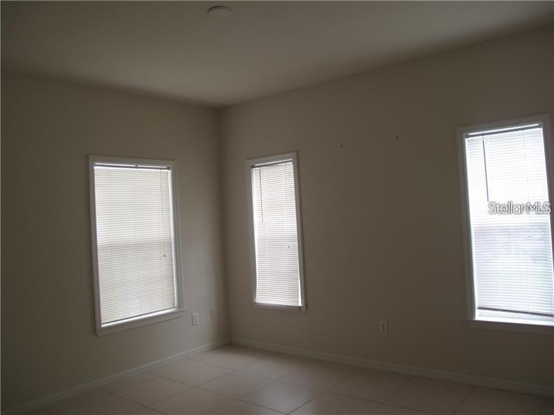 3593 Conroy Road, Unit 421 Orlando, FL 32839 - Photo 9 of 28 a view of an empty room with a window