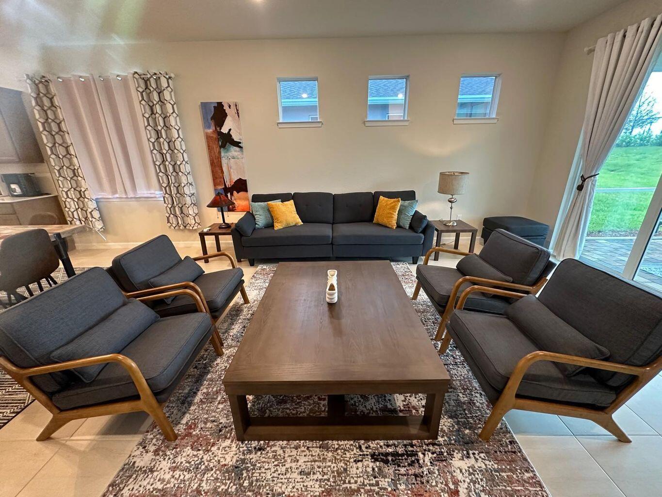 13897 Southwest Gingerline Drive Port St. Lucie, FL 34987 - Photo 1 of 74 a living room with furniture and a fireplace