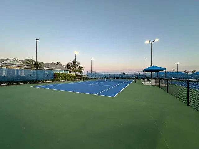 a bedroom with a bed and a lamp