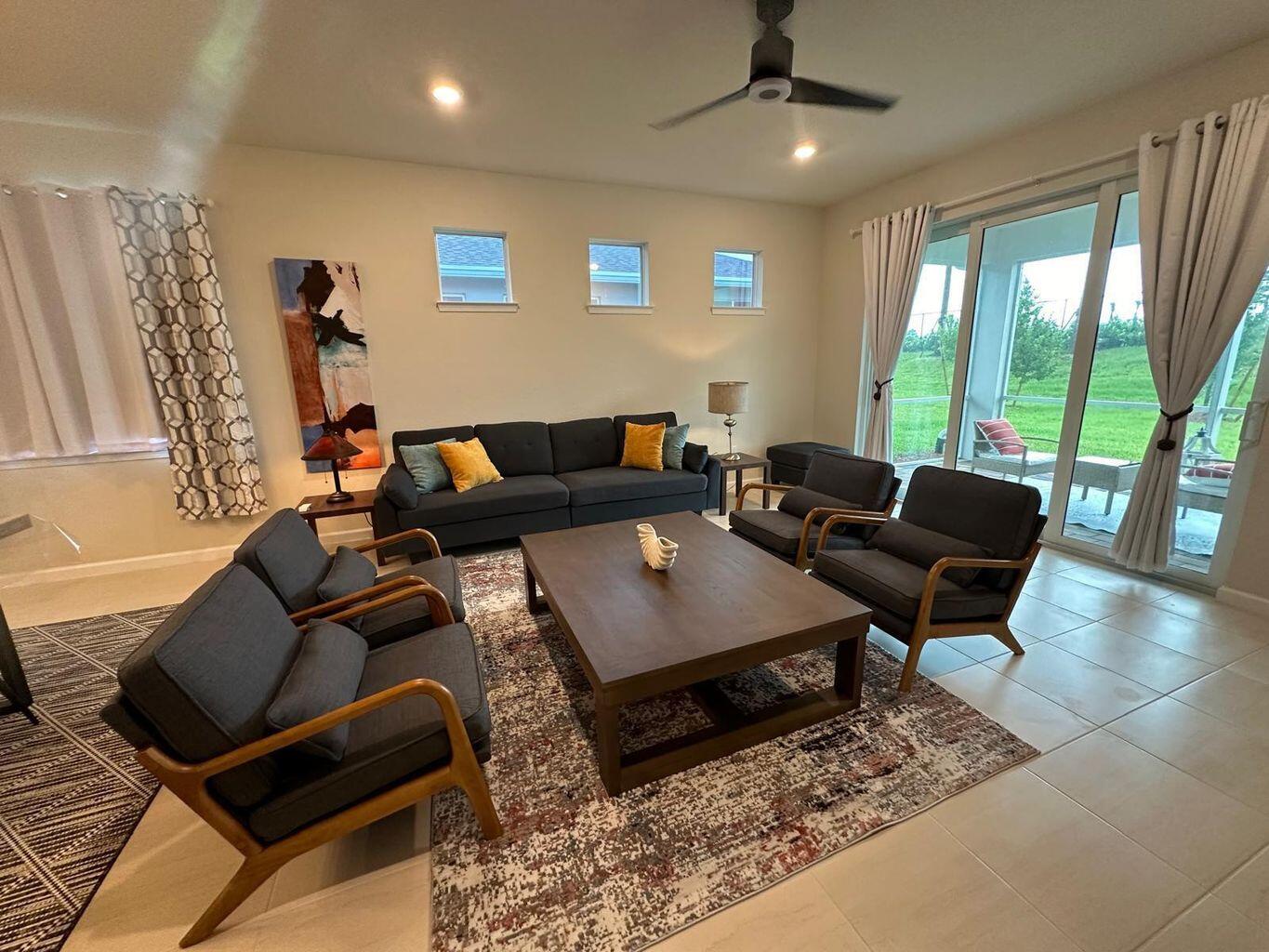 13897 Southwest Gingerline Drive Port St. Lucie, FL 34987 - Photo 3 of 74 a living room with furniture and a large window