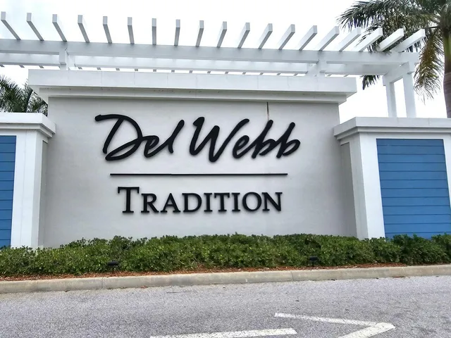 a kitchen with stainless steel appliances a sink a counter top space cabinets and stainless steel appliances