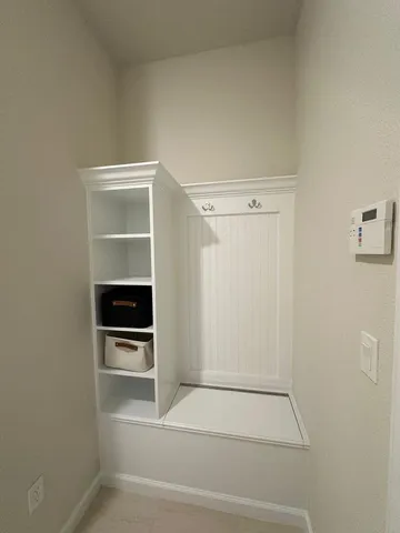 a large kitchen with a large counter top a sink a stove a refrigerator and a cabinets