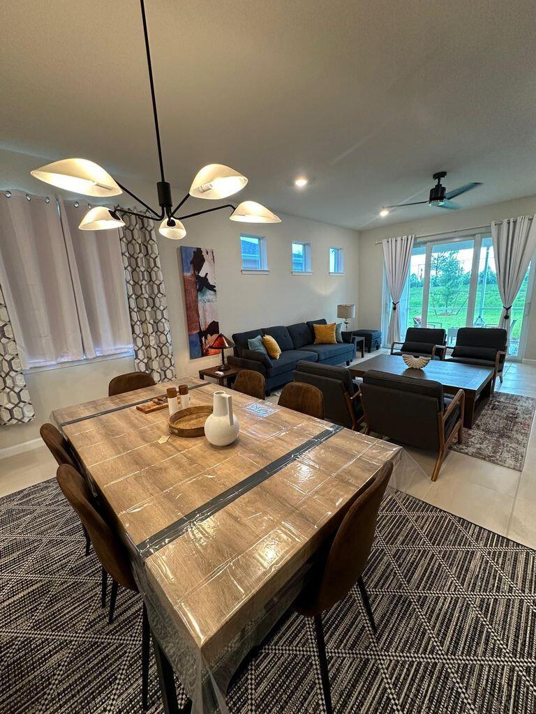 13897 Southwest Gingerline Drive Port St. Lucie, FL 34987 - Photo 37 of 74 a view of a dining room with furniture